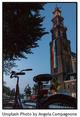 Church banner reading All Are Welcome, raised as a Pride weekend witness of God’s inclusive love.