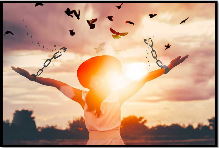 A silhouetted figure stands with arms lifted toward the sky as broken chains fall away and birds take flight, symbolizing the freedom of forgiveness.