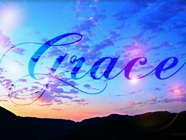 Sunrise sky in shades of blue and pink with the word ‘Grace’ scripted across it