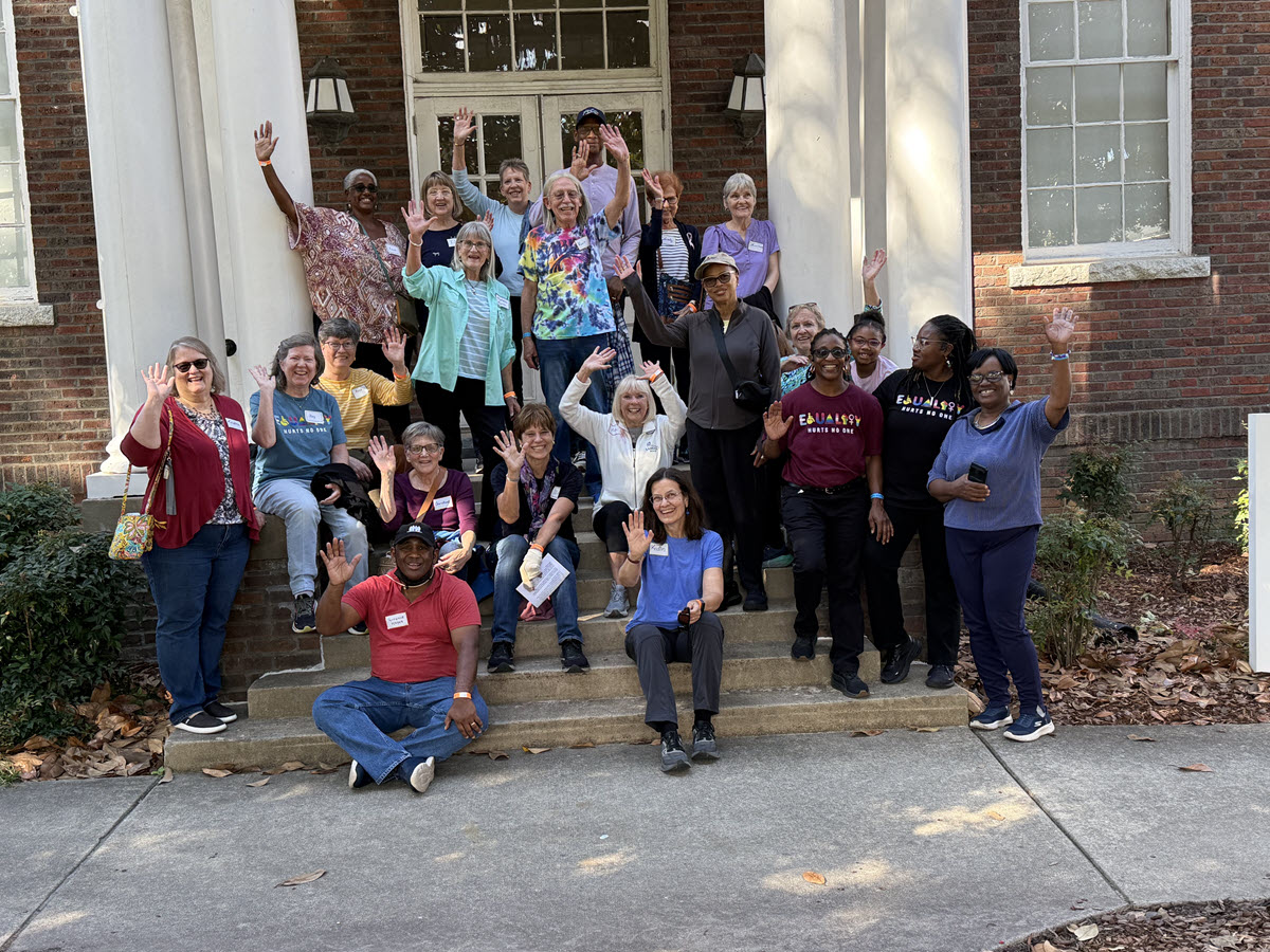 Holy Covenant pilgrims wave on the steps of a Bennett College building, recognizing the women who planned and sustained the sit-ins — Photo courtesy of Kristin