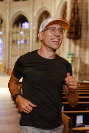 Person running joyfully down cathedral aisle.