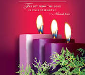 The Advent candle of joy glowing in the sanctuary at Holy Covenant UCC.