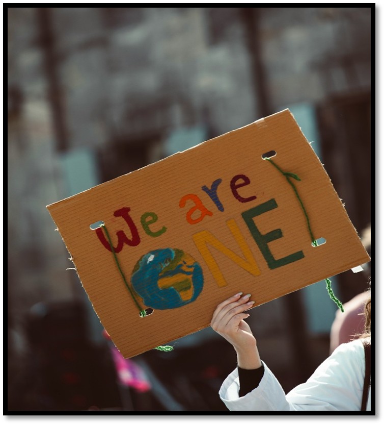 Advent candles and signs of love arranged as symbols of peace and welcome.